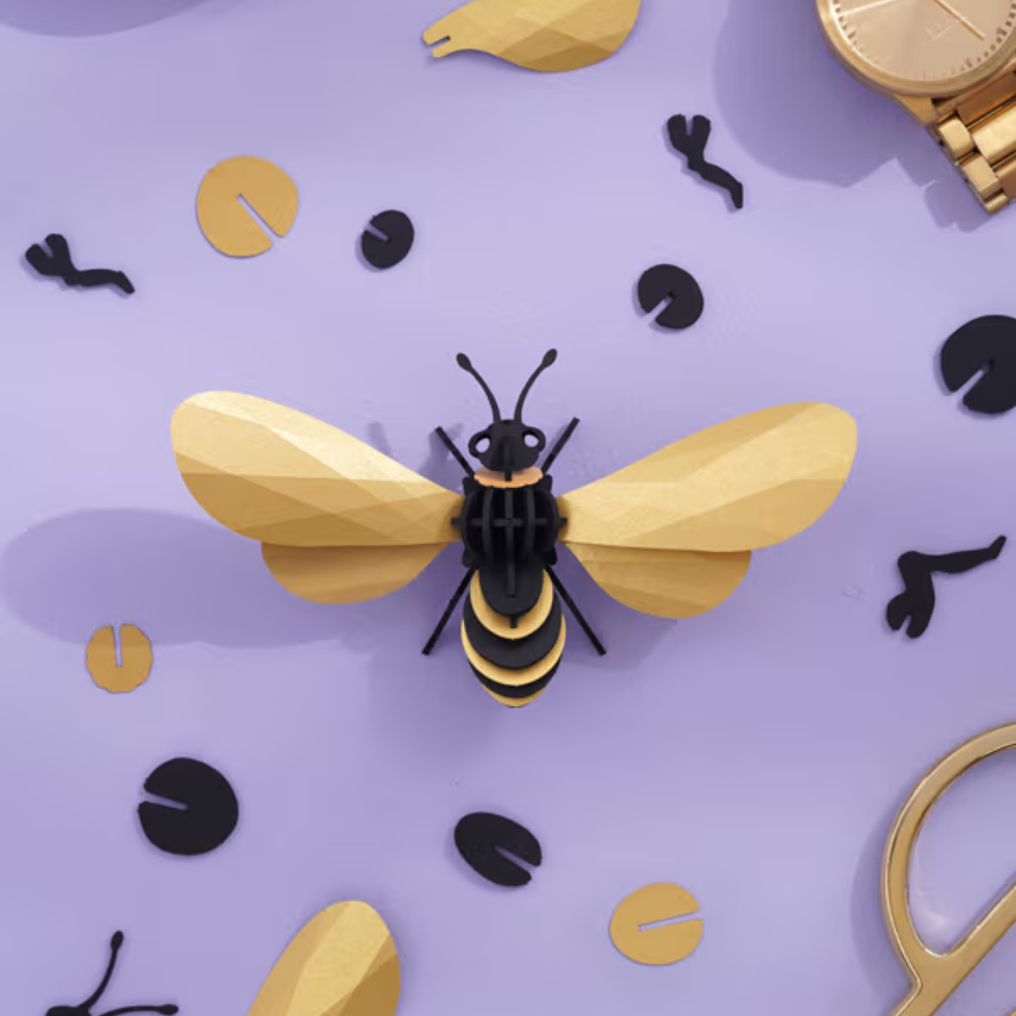 Assembli 3D-puzzel Honingbij goud met losse onderdelen op paarse achergrond