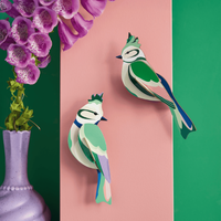 Studio Roof Forest Crests vogels aan roze muur